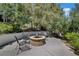 Relaxing fire pit area surrounded by lush landscaping at 22 Augusta Canyon Way, Las Vegas, NV 89141