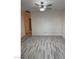 Living room with light gray vinyl flooring and ceiling fan at 512 N 1St St, Las Vegas, NV 89101