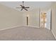 Spacious bedroom with ceiling fan and access to bathroom and closet at 10032 Hope Island Dr, Las Vegas, NV 89134