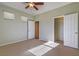 Bright bedroom with ceiling fan and double-door closet at 5860 Alfano Ave, Pahrump, NV 89061