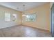 Bright dining room with tile floors and a view to the backyard at 5860 Alfano Ave, Pahrump, NV 89061