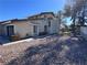 Two-story house with a two-car garage and rock landscaping at 8817 Borla Dr, Las Vegas, NV 89117