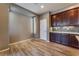 Bright breakfast nook with wood floors and view to kitchen at 5709 Pleasant Palms St, North Las Vegas, NV 89081