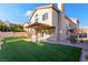 Artificial turf backyard with pergola and patio at 7813 Paper Flower Ct, Las Vegas, NV 89128