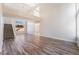 Two-story living room with high ceilings and wood-look floors at 7813 Paper Flower Ct, Las Vegas, NV 89128