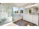 Main bathroom with double vanity, walk-in shower, and soaking tub at 7813 Paper Flower Ct, Las Vegas, NV 89128