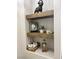 Rustic wooden shelves add charm and storage to this bathroom at 7813 Paper Flower Ct, Las Vegas, NV 89128