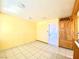 Simple dining area with tile flooring and built-in storage at 5220 Del Rey Ave, Las Vegas, NV 89146