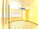 Bright bedroom with tile flooring and ceiling fan at 5220 Del Rey Ave, Las Vegas, NV 89146