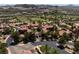 Aerial view of community showing homes, landscaping, and golf course views at 26 Cerchio Alto, Henderson, NV 89011