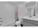 Clean bathroom featuring a bathtub, toilet, and gray vanity at 10772 Briset Ct, Las Vegas, NV 89166