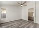 Main bedroom with ceiling fan and ensuite bathroom access at 5855 Rose Sage St, North Las Vegas, NV 89031