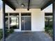 Private entrance with modern door and welcome mat at 8925 W Flamingo Rd # 121, Las Vegas, NV 89147