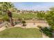 Backyard with putting green and elevated golf course view at 11534 Glowing Sunset Ln, Las Vegas, NV 89135