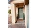 Inviting entryway with a green door and potted plants at 9927 Copano Bay Ave, Las Vegas, NV 89148