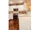 Kitchen with white cabinets, stainless steel appliances and hardwood floor at 9927 Copano Bay Ave, Las Vegas, NV 89148