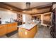 Modern kitchen with island, granite countertops, and stainless steel appliances at 564 Campus Oaks Ct, Las Vegas, NV 89183