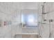 Spa-like bathroom with a soaking tub and walk-in shower at 4381 W Flamingo Rd # 10303, Las Vegas, NV 89103