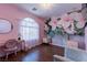 Charming bedroom with a pink color scheme and floral wall mural at 10052 Baystone St, Las Vegas, NV 89141