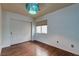 Bright bedroom featuring hardwood floors and double door closet at 10052 Baystone St, Las Vegas, NV 89141