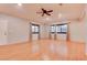 Spacious living room with light walls, hardwood floors and ceiling fan at 744 Apple Tree Ct, Henderson, NV 89014