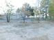 Side yard with mature trees at 770 Greta Blvd, Pahrump, NV 89060