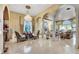 Living room with arched entryways and a crystal chandelier at 2200 Glenbrook Way, Las Vegas, NV 89117