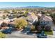 Aerial view of house and neighborhood with mountain views at 11132 Ferragamo Ct, Las Vegas, NV 89141