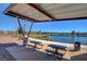 Covered picnic area with tables overlooking lake at 76 Summer Rhapsody Ave, Henderson, NV 89015