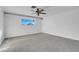 Bright bedroom with ceiling fan and carpet flooring at 1728 Griffith Ave, Las Vegas, NV 89104