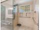 Large walk-in shower with multiple shower heads and safety bars at 3124 Terry St, Las Vegas, NV 89108