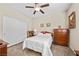 Bright bedroom with double bed and wooden dresser at 3324 Tranquil Garden St, Las Vegas, NV 89117