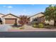 Single-story home with attached garage and landscaped front yard at 3324 Tranquil Garden St, Las Vegas, NV 89117