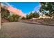 Gravel backyard with a fenced perimeter at 3647 Waynesvill St, Las Vegas, NV 89122