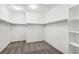 Large walk-in closet with shelving and carpet flooring at 391 Mano Destra Ln, Henderson, NV 89011