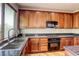 Modern kitchen with stainless steel appliances and granite at 11837 Luna Del Mar Ln, Las Vegas, NV 89138