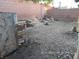 Large backyard with gravel and a shed at 7621 Ribbon Rock Ct, Las Vegas, NV 89139