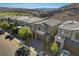 Aerial view of a two-story house with a desert backdrop at 49 Strada Moscato, Henderson, NV 89011