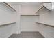 Spacious walk-in closet with ample shelving for storage at 49 Strada Moscato, Henderson, NV 89011