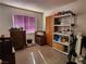 Bedroom with wooden dresser and shelving unit at 2106 Pebble Creek Ln, Laughlin, NV 89029