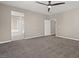 Large bedroom with ensuite bathroom access and ceiling fan at 7051 Denio Island St, North Las Vegas, NV 89084