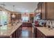 Spacious kitchen featuring granite island and hardwood floors at 816 Stannard Ct, Henderson, NV 89052