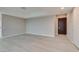 Living room with hardwood floors and access to balcony at 4525 Dean Martin Dr # 2704, Las Vegas, NV 89103