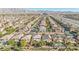 Aerial view of neighborhood near highway and mountains at 6869 Quiet Peeps Pl, North Las Vegas, NV 89084