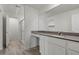 Modern bathroom with a vanity, large mirror, and walk-in shower at 1712 Desert Path Ave, North Las Vegas, NV 89032