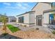 Modern home exterior with a landscaped front yard and walkway at 6380 Leeland Ct, Las Vegas, NV 89149