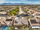 Aerial view of house with solar panels, pool, and mountain views at 7126 Spindle Berry St, Las Vegas, NV 89131