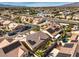 Aerial view of house with solar panels, pool, and desert landscape at 7126 Spindle Berry St, Las Vegas, NV 89131