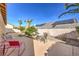 Backyard patio with seating area and gravel landscaping at 7126 Spindle Berry St, Las Vegas, NV 89131