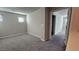 Two bedrooms with carpet and access to a closet at 3816 Seyfert Ave, North Las Vegas, NV 89084